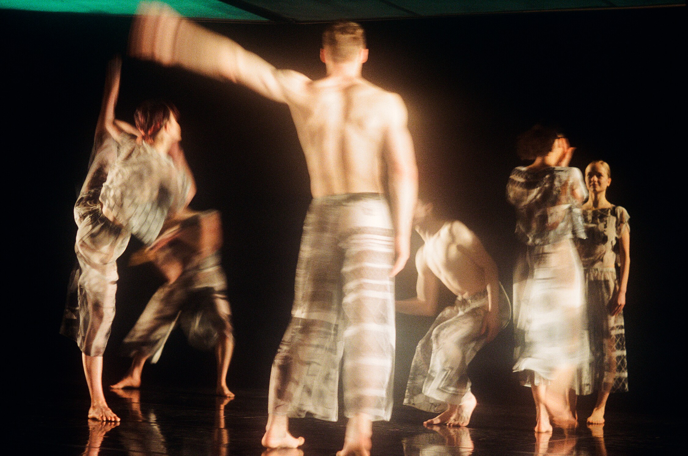 Six dancers standing and in movement