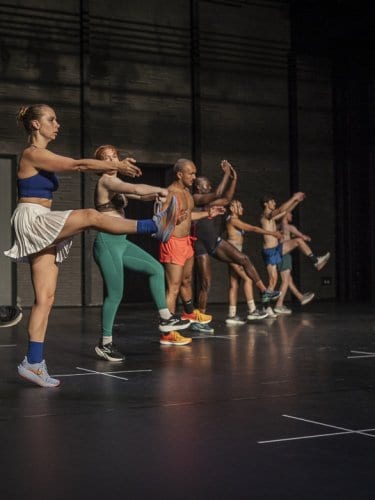 Dancers standing in a line diagonally