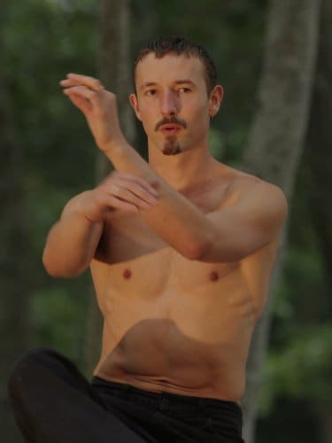 Cassiel Gaube dancing with his hands in front of him