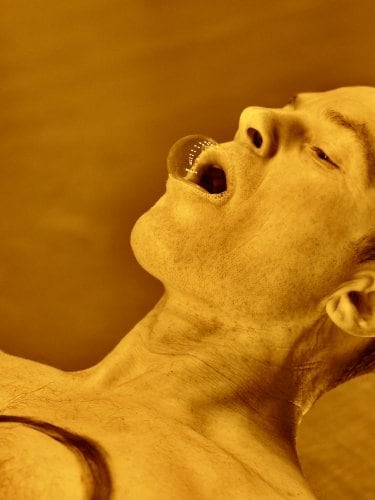 A dancer with a bubble in his mouth.