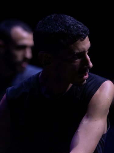 dancer in a dark stage
