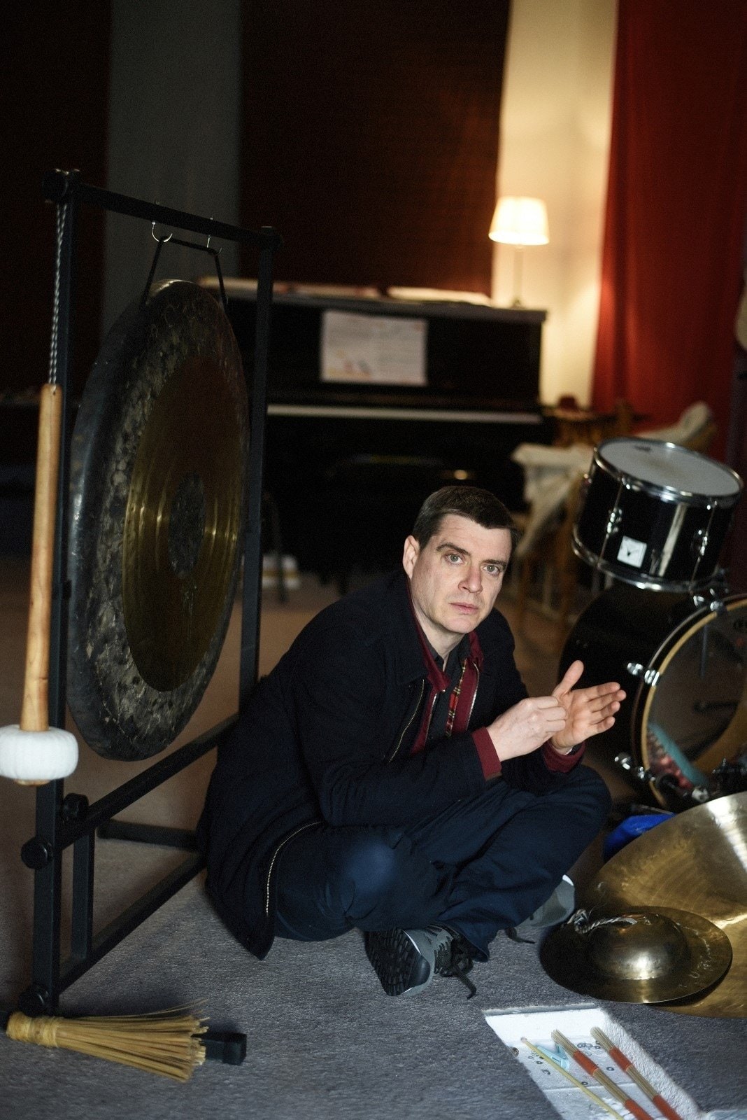 Portrait of Will Guthrie sitting on the floor