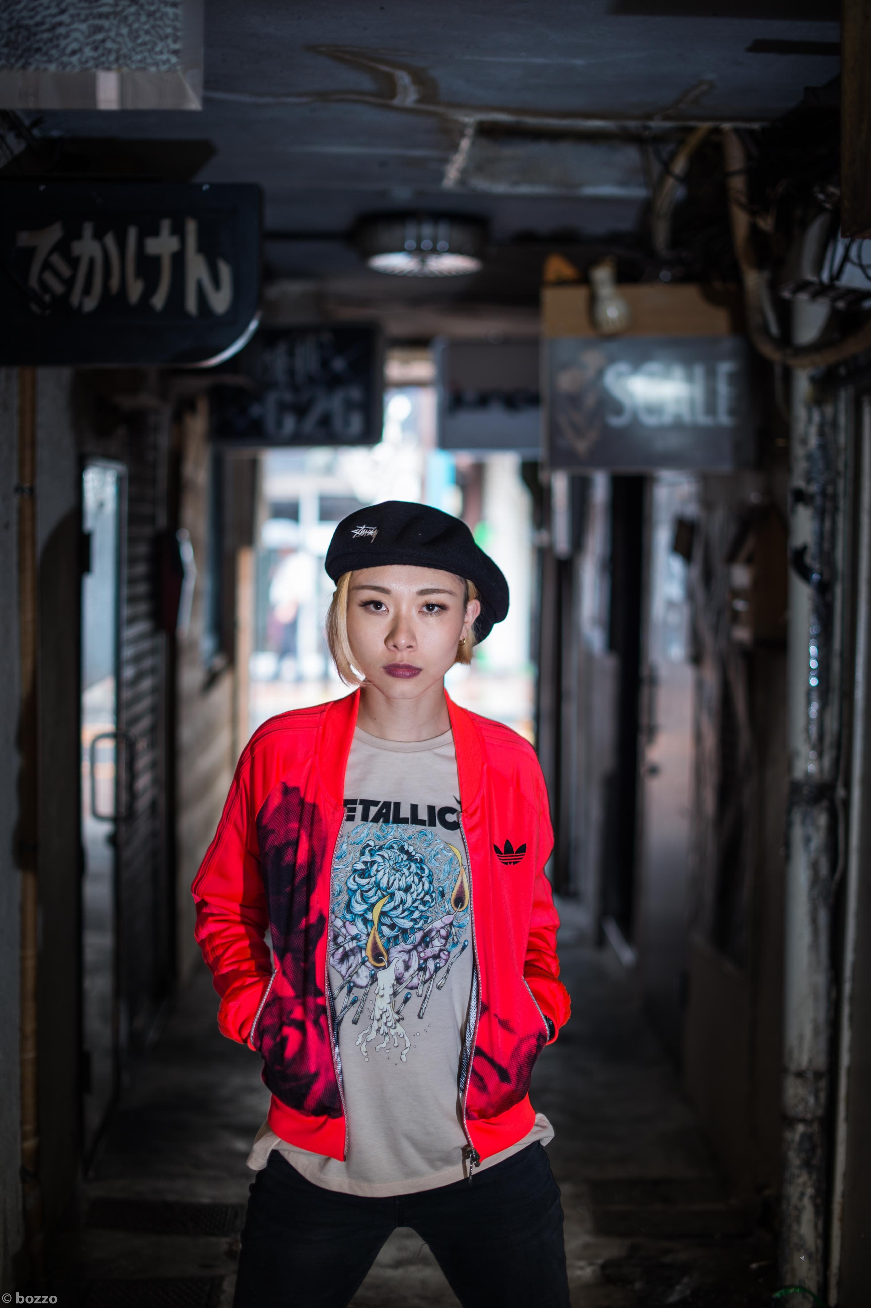 Portrait of Yu Okamoto with a red bomber jacket and black beret, cowboy shot