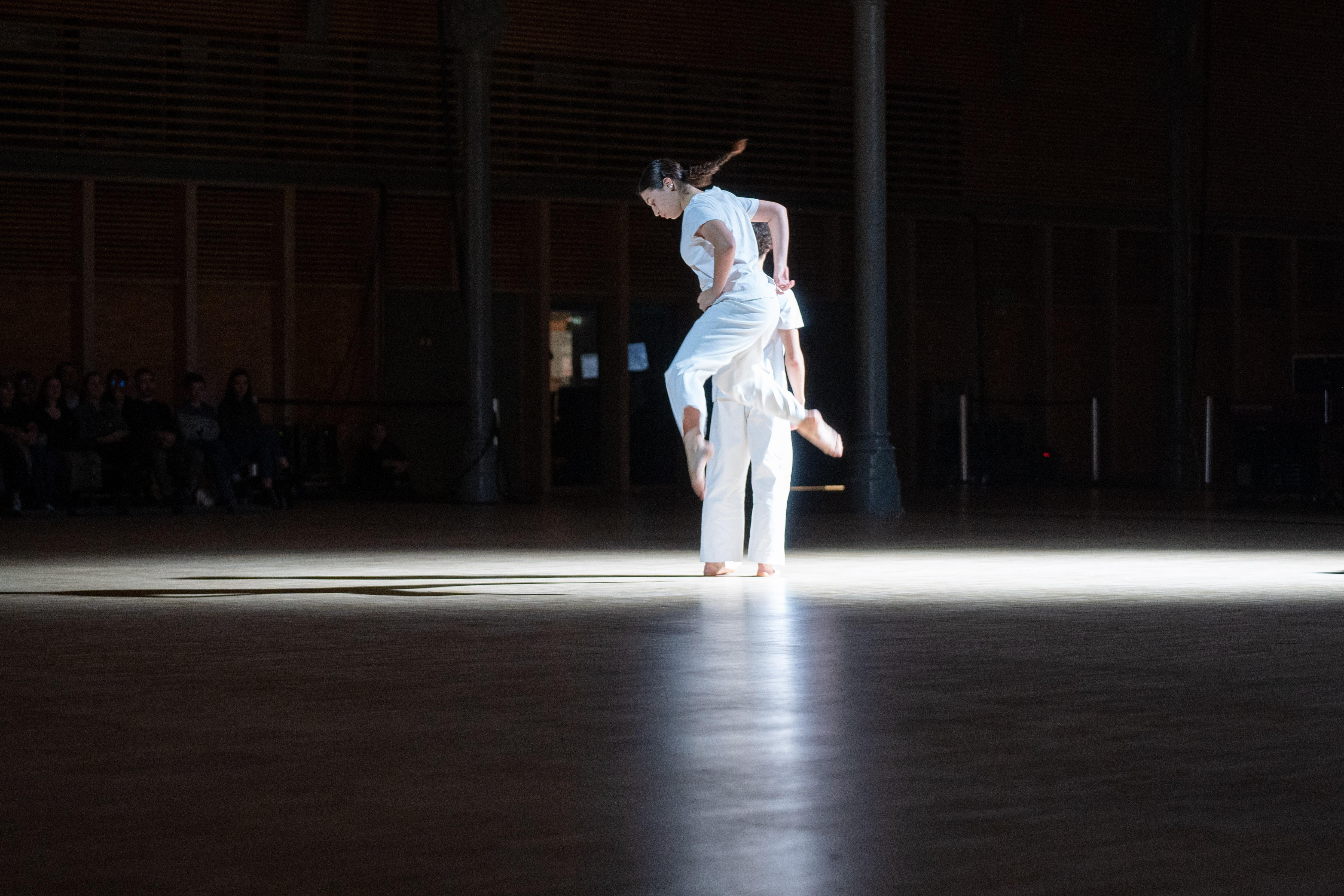 Dancer in jumping position looking down