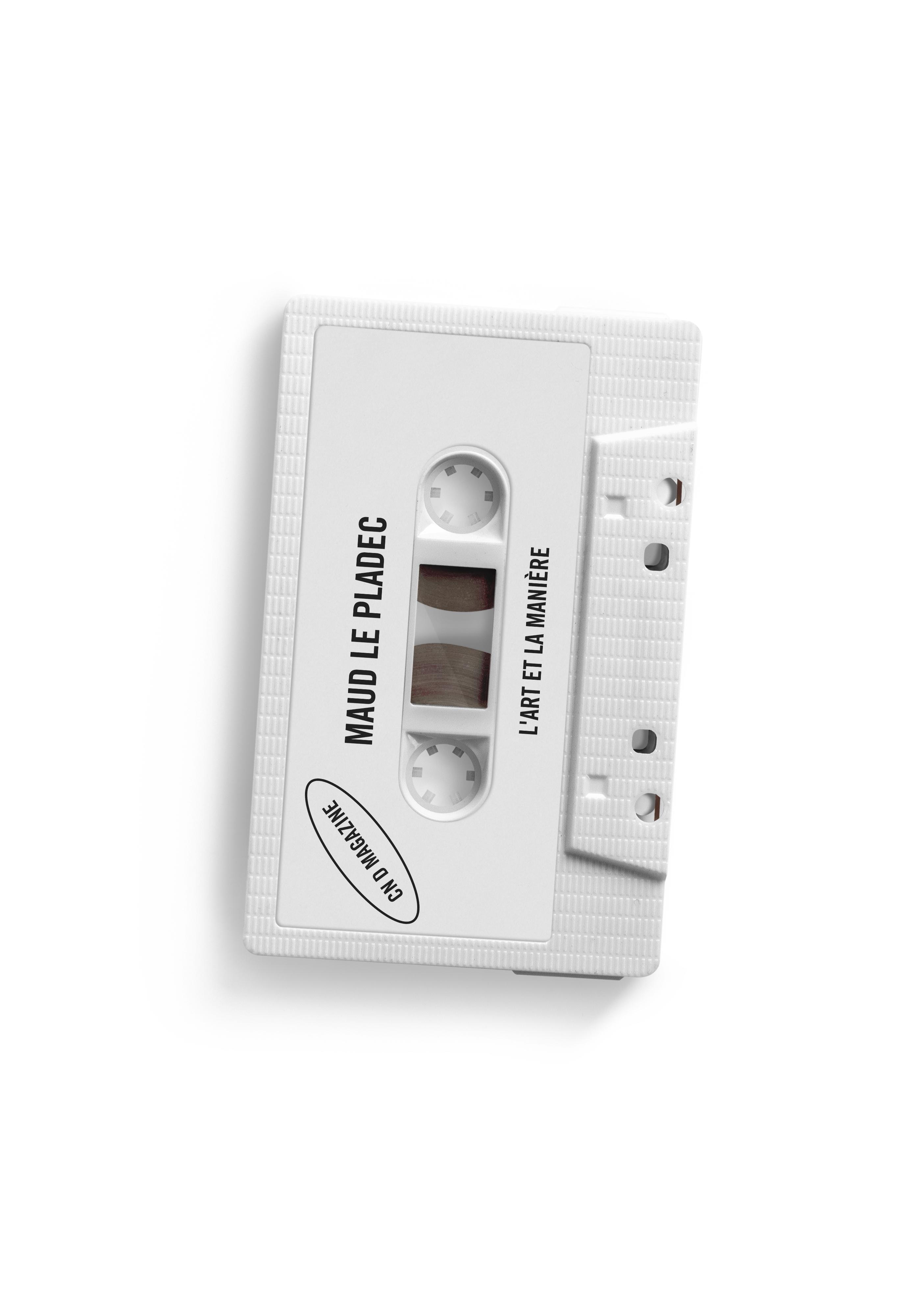 A white audio cassette with the name of Maud Le Pladec