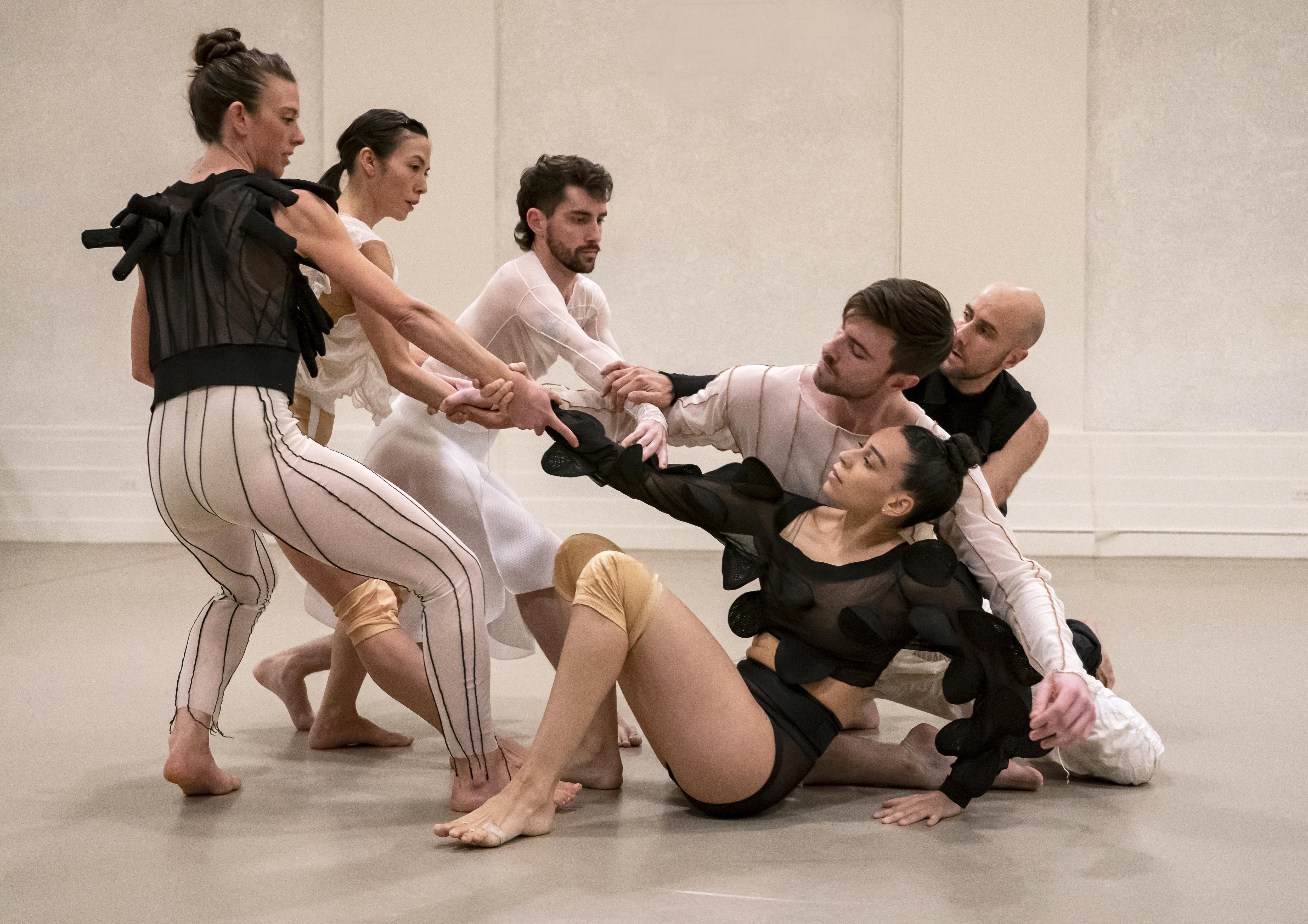 Performers of Let’s Talk About Bleeding by Judith Sánchez Ruíz holding hands tightly