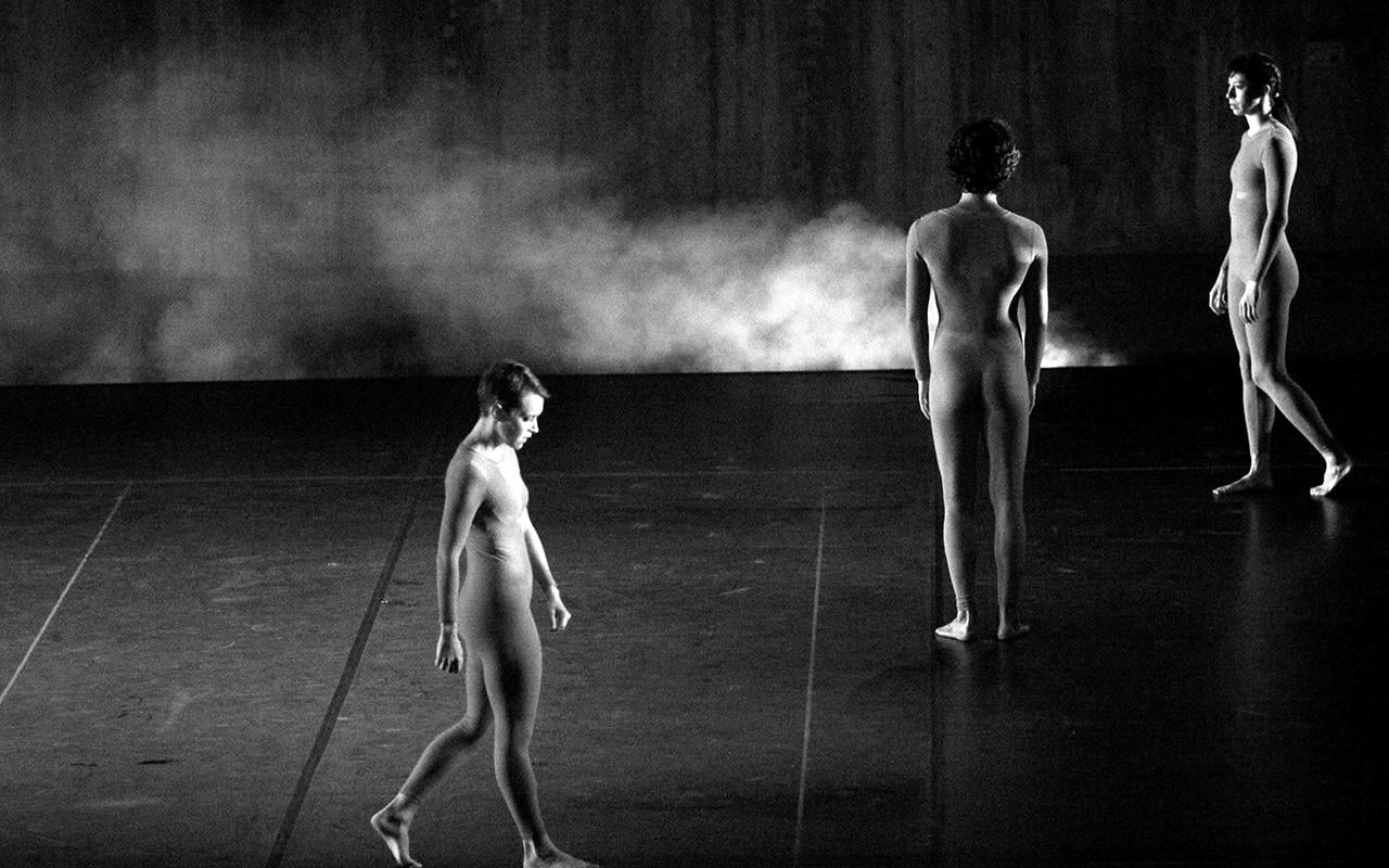 Three dancers on stage in diagonal