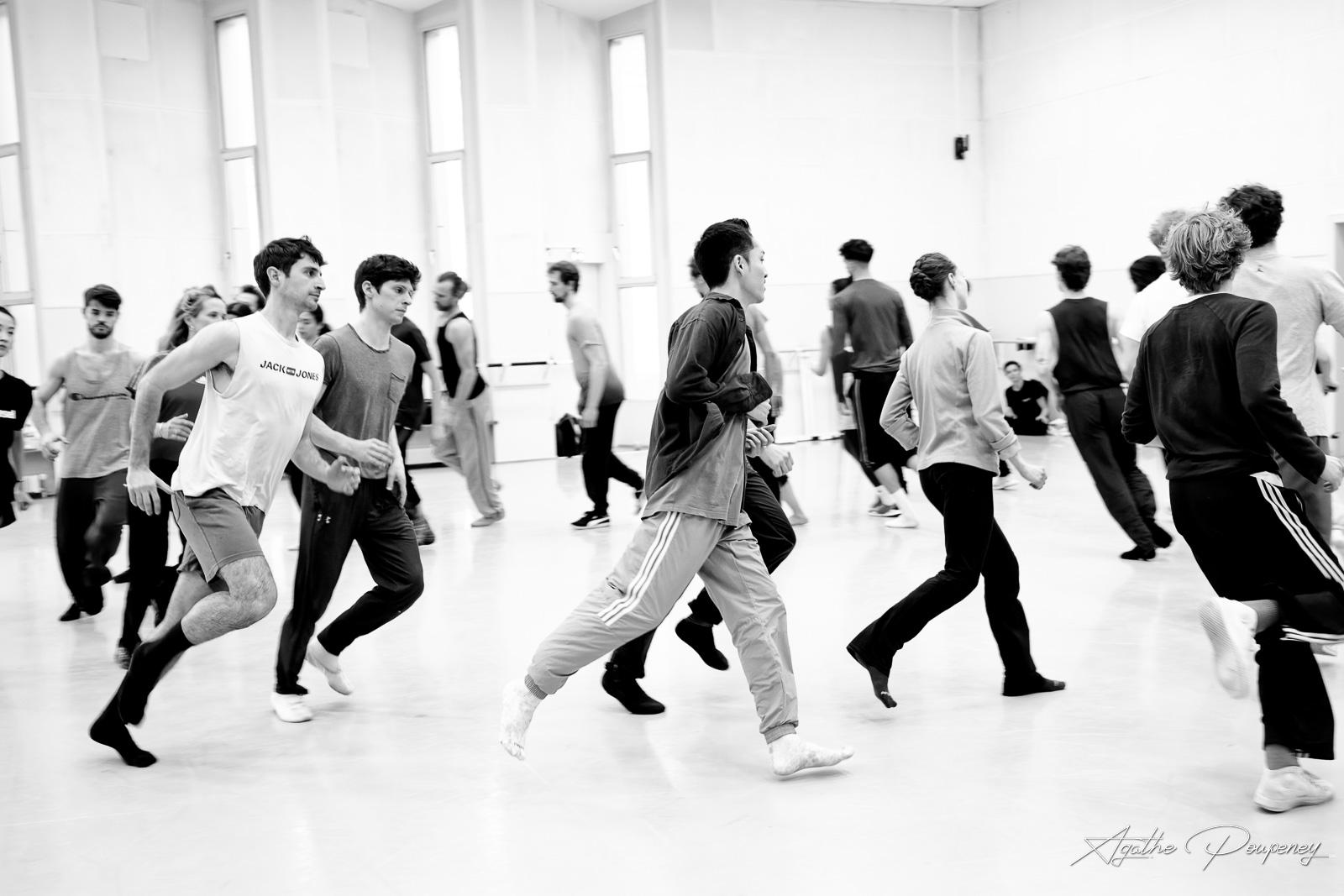Dancers run in rehearsal