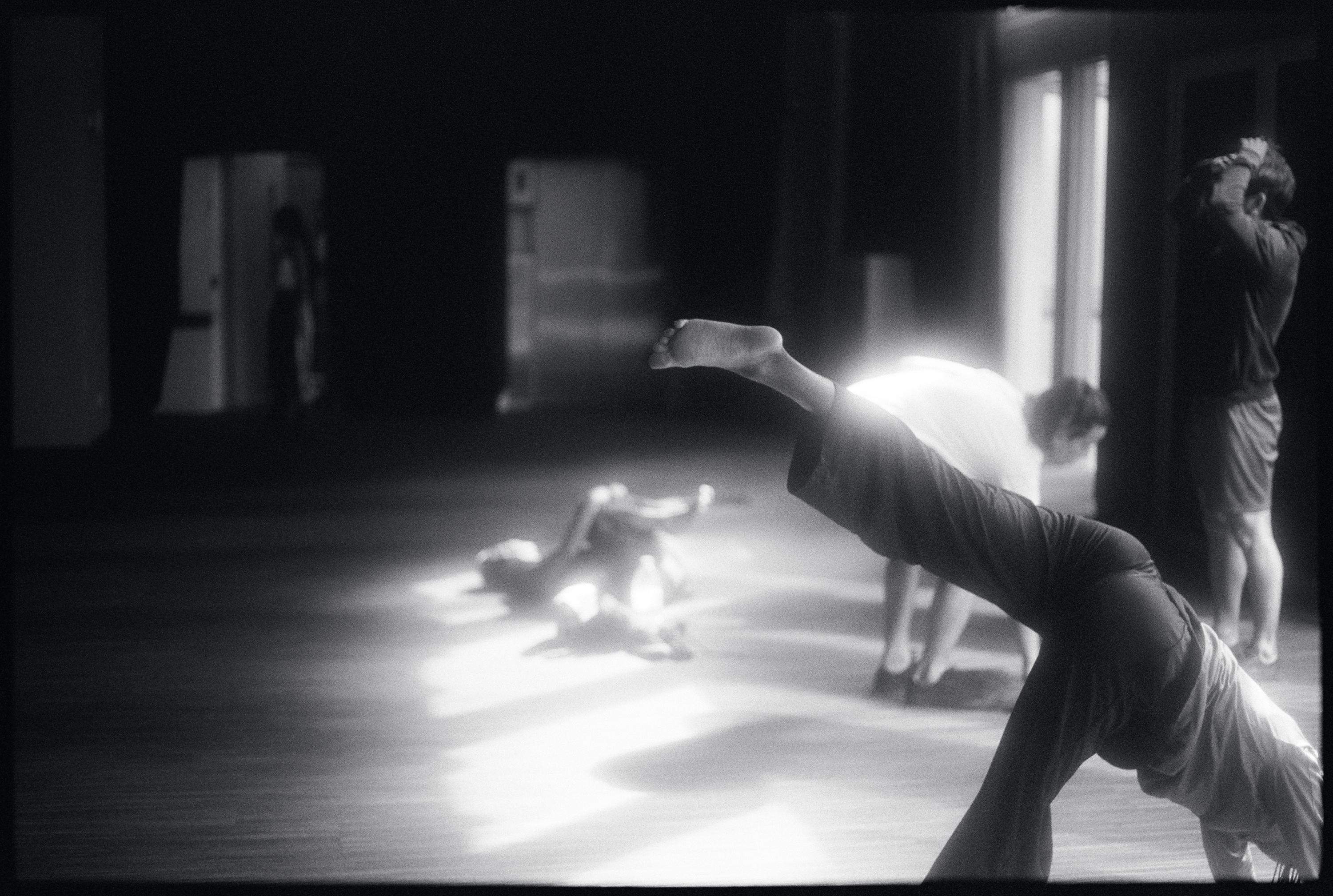  Dancers in movement, stretching in the studio 