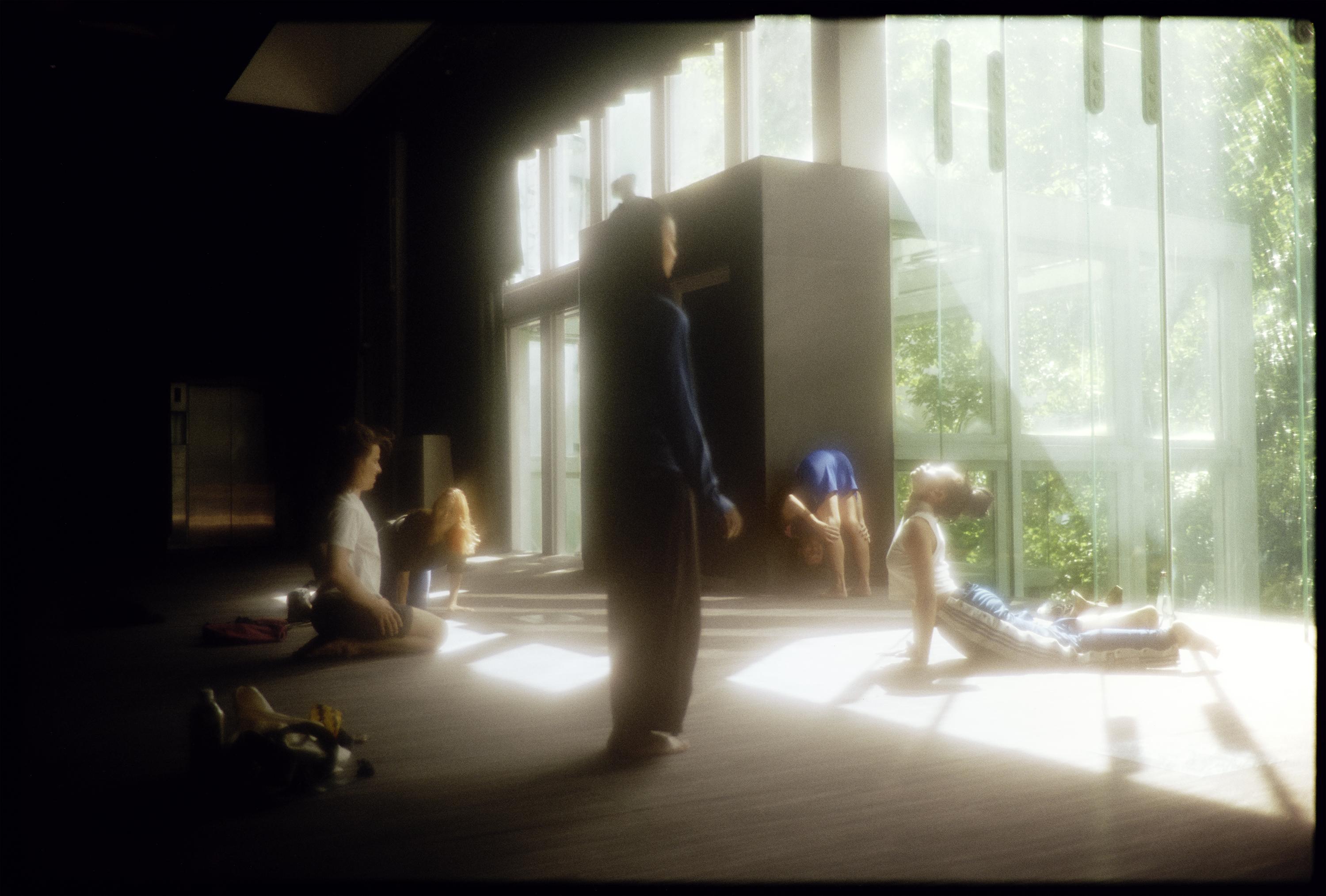 Dancers stretching in a studio