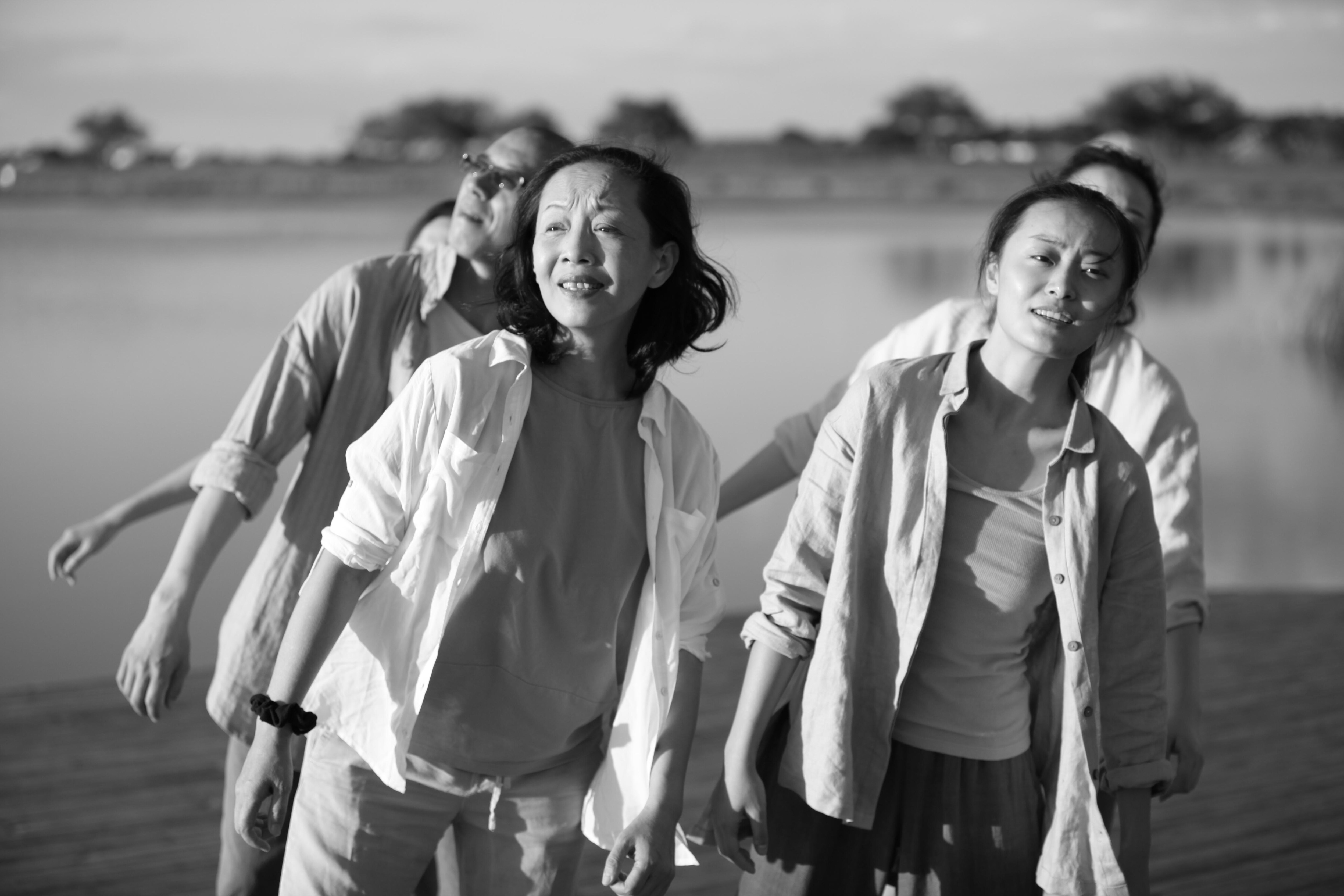 Four women in the countryside, black and white photo