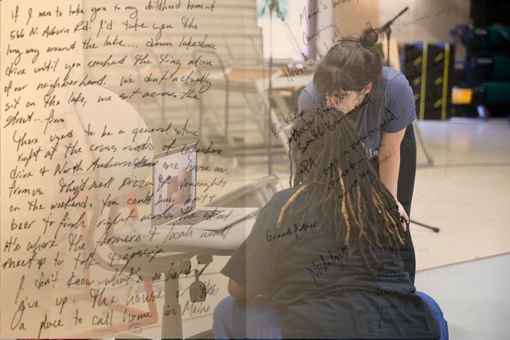 Image of Kate and Kayla, both of whom are squatting looking at a computer. Overlaid on the left hand side is handwritten journal text.  
