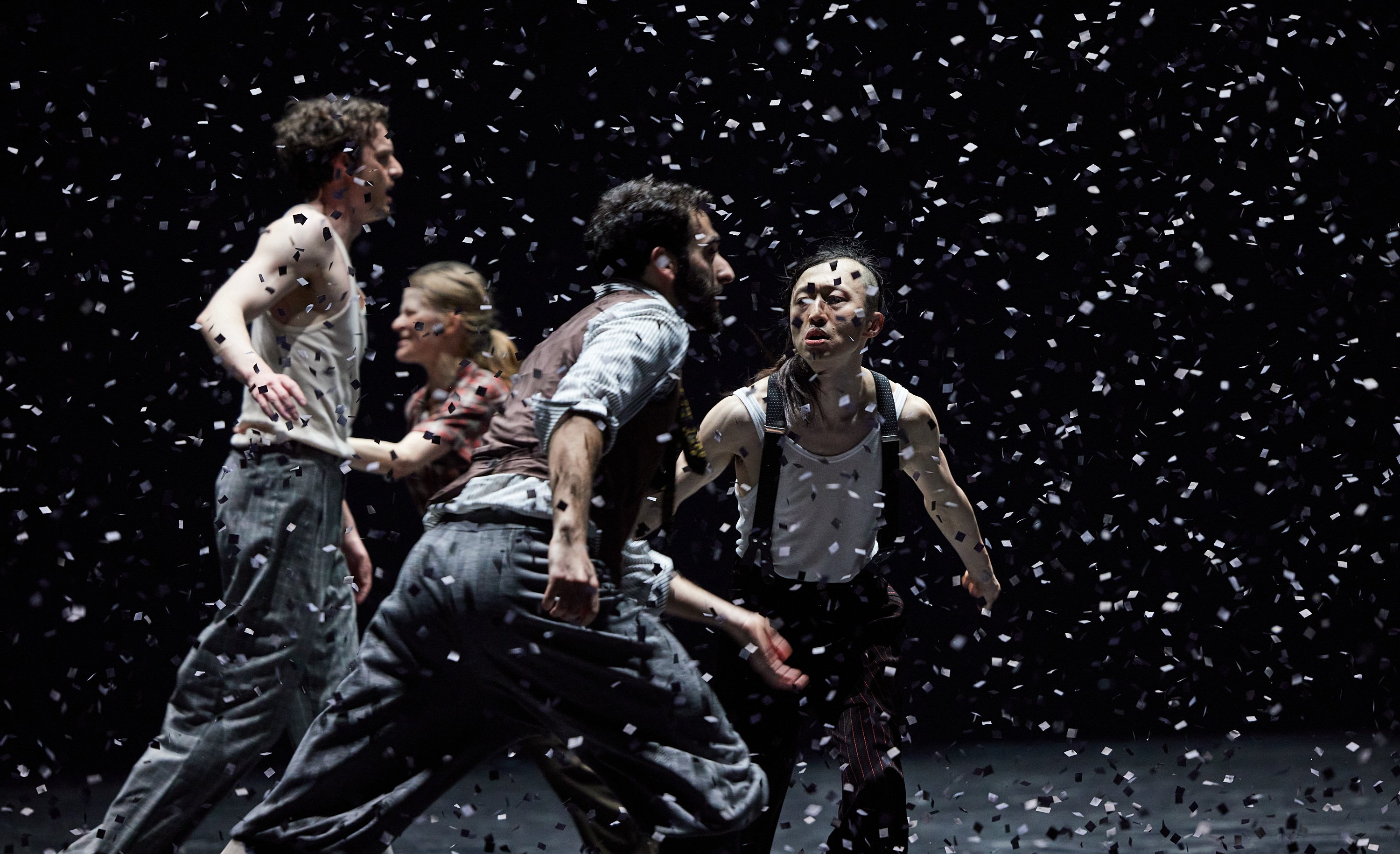 Four dancers under confetti