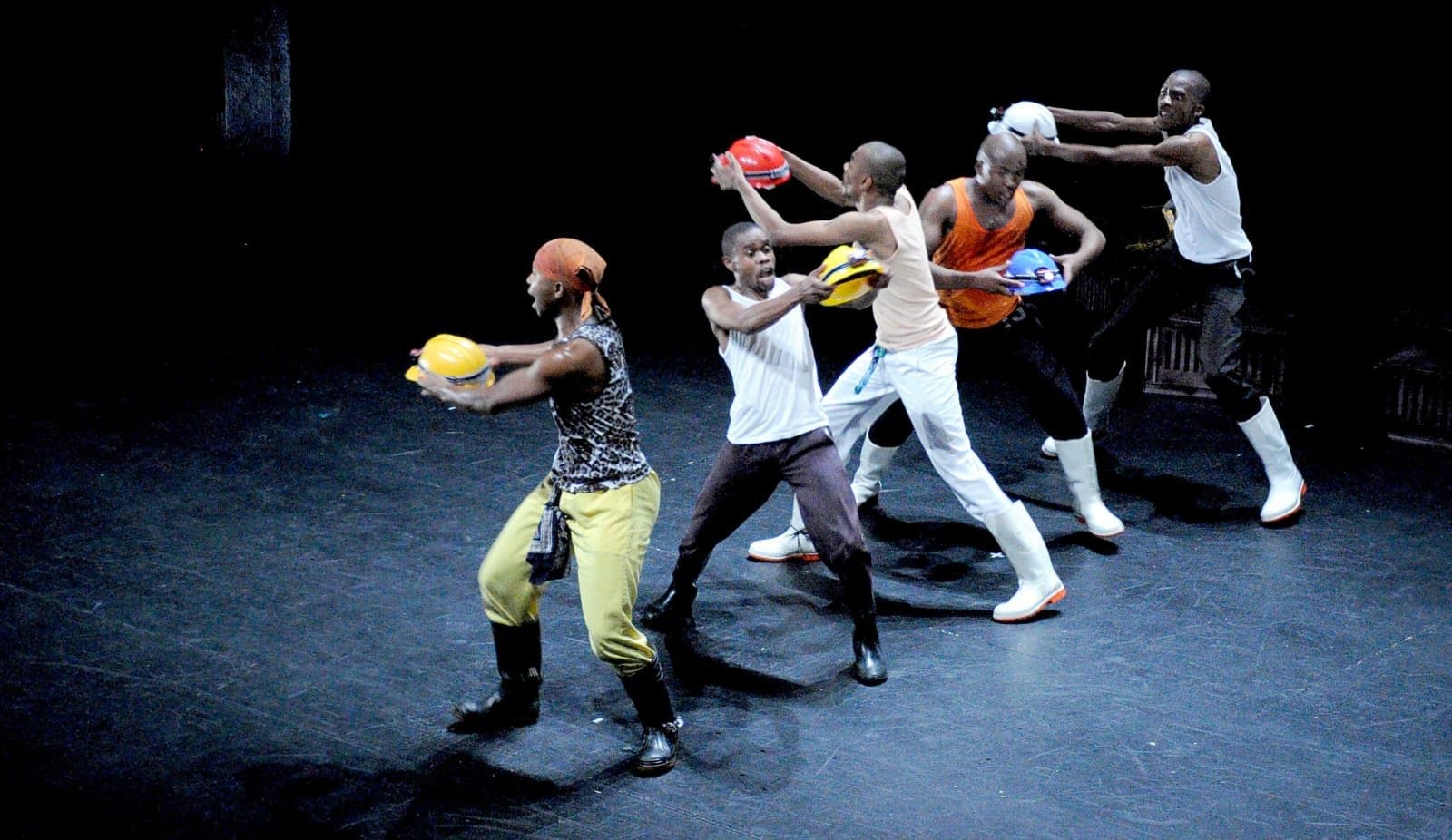 A group of dancers performing in a line.