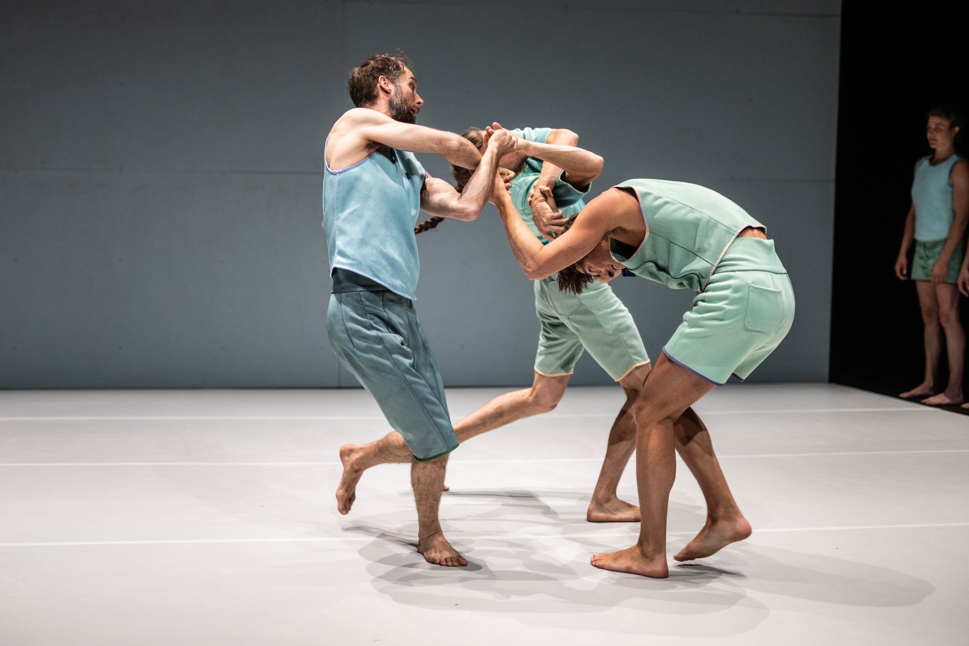 Trio of dancers in a white scenography