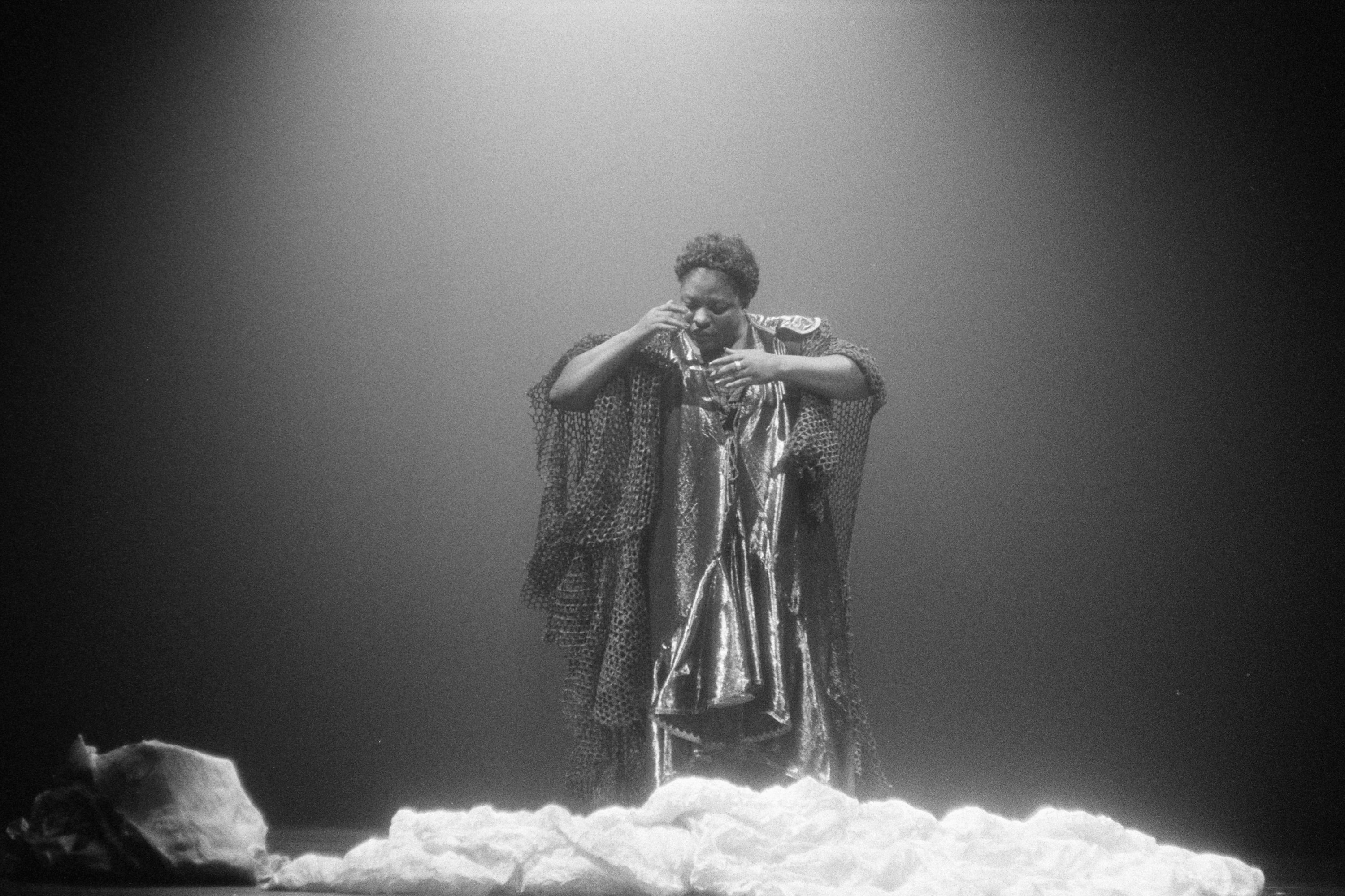 Elsa Wolliaston on stage in a loose dress, black and white photo