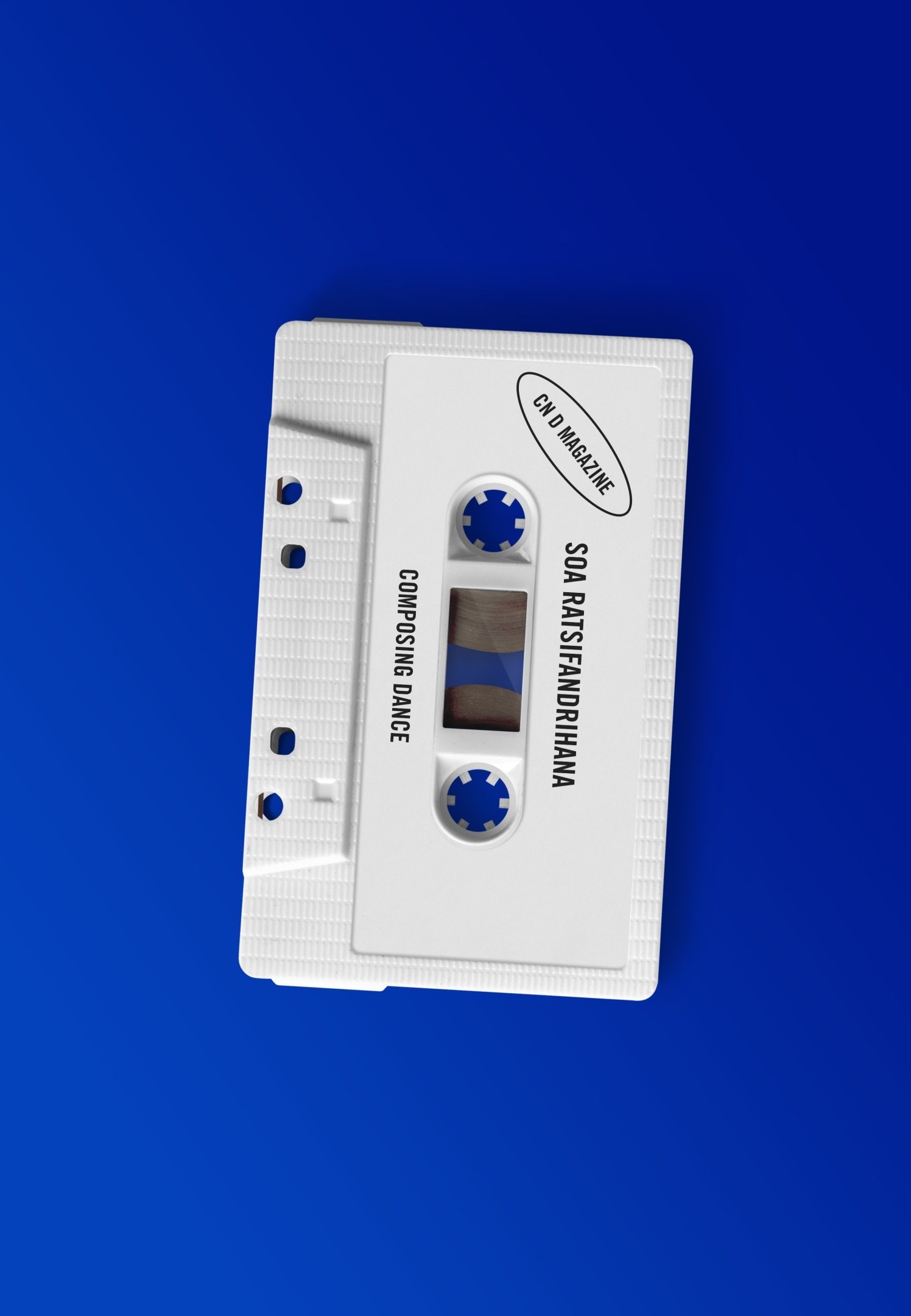 White audio cassette on blue background 