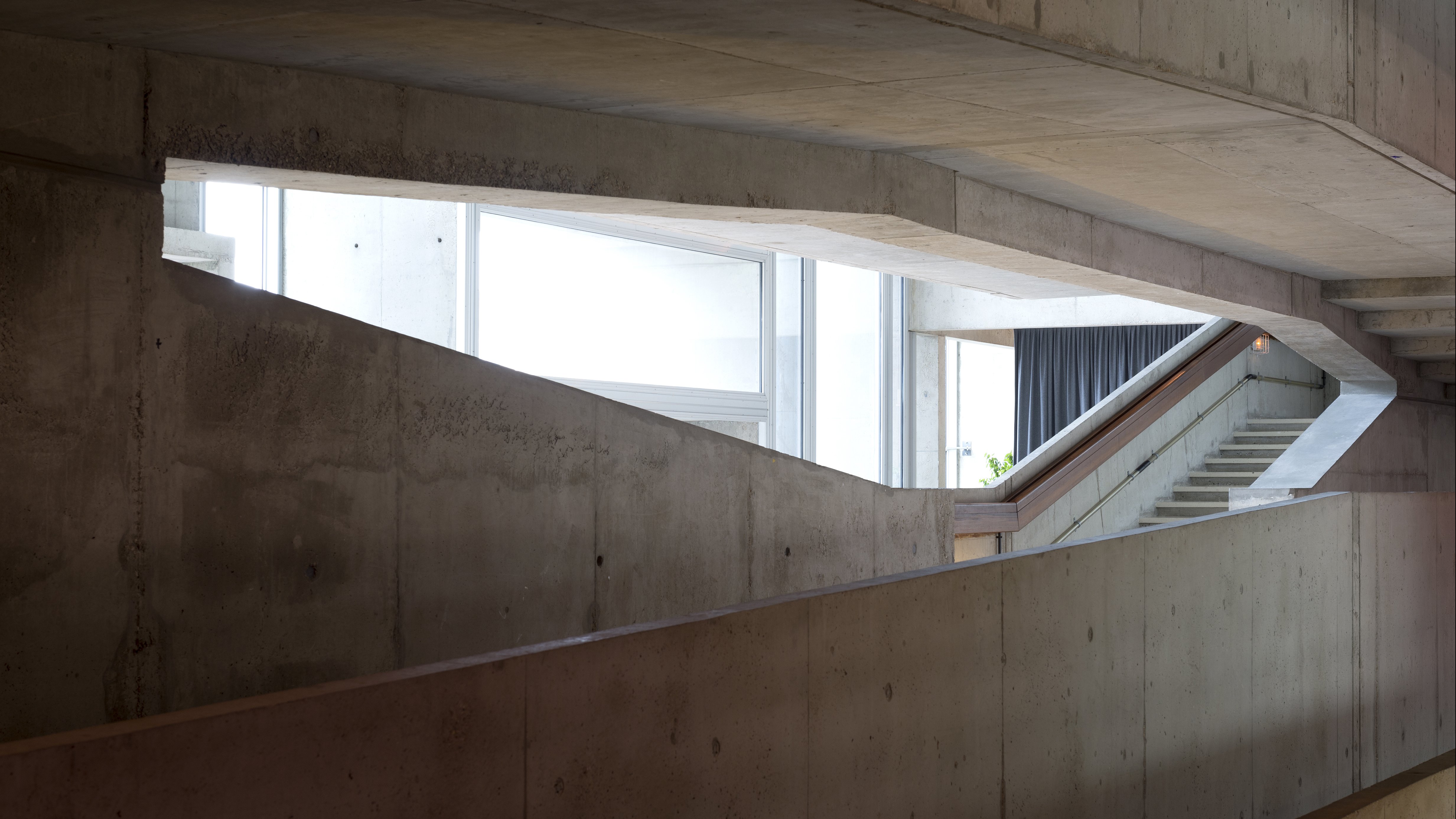 the stairs of a concrete building