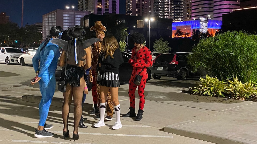 a group of people in front of buildings in Houston