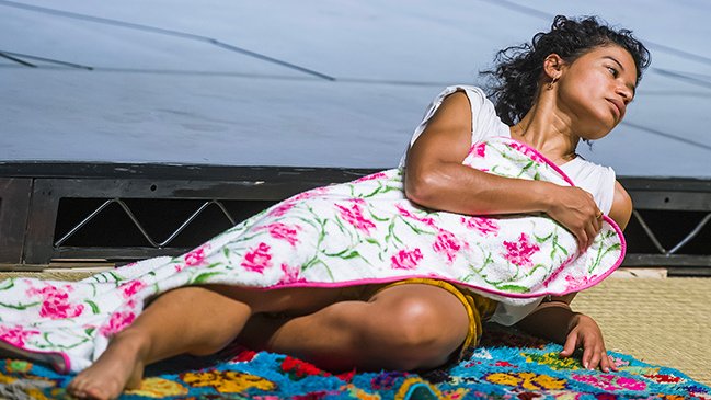 Dancer almost lying down with a blanket