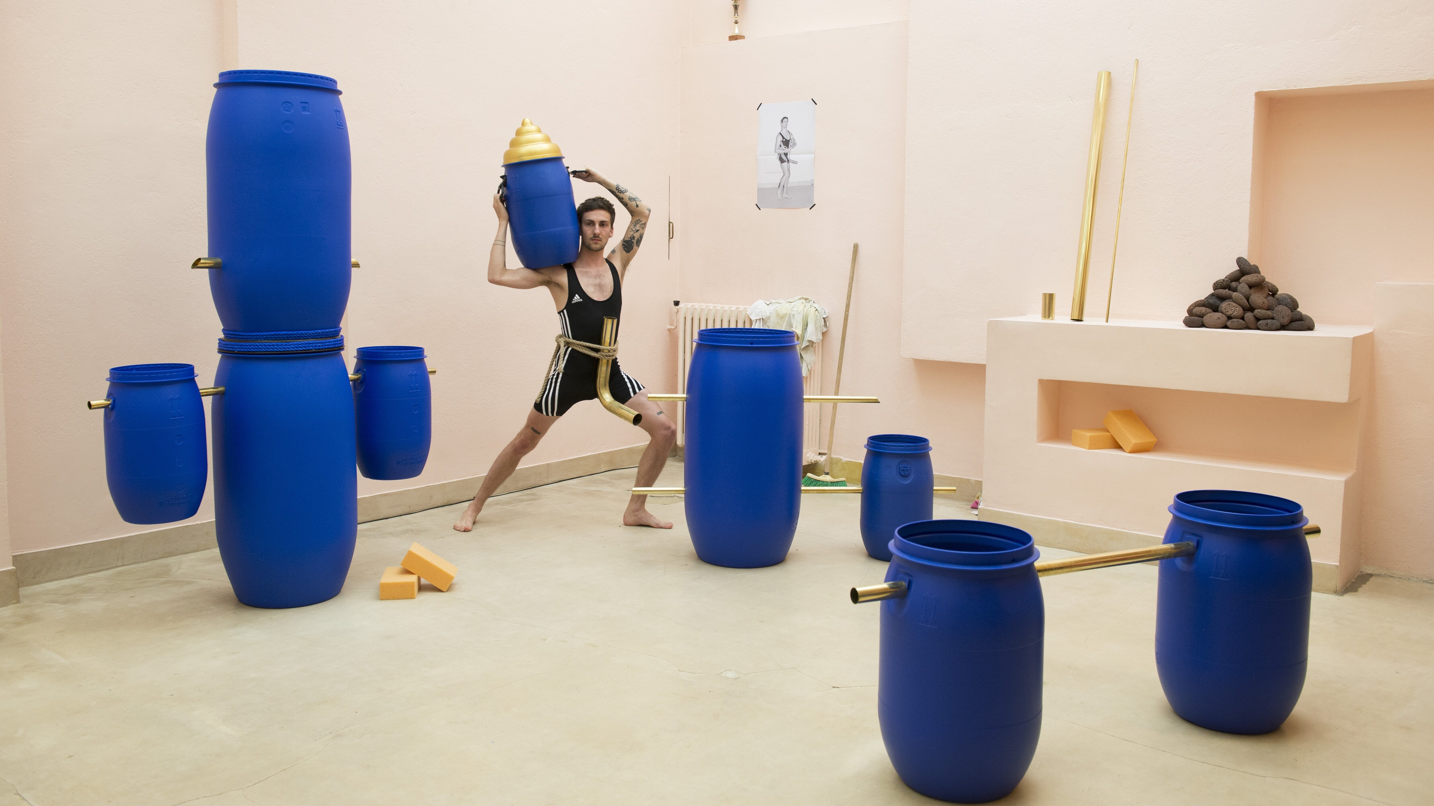 Man surrounded by blue cans, from Deep Water