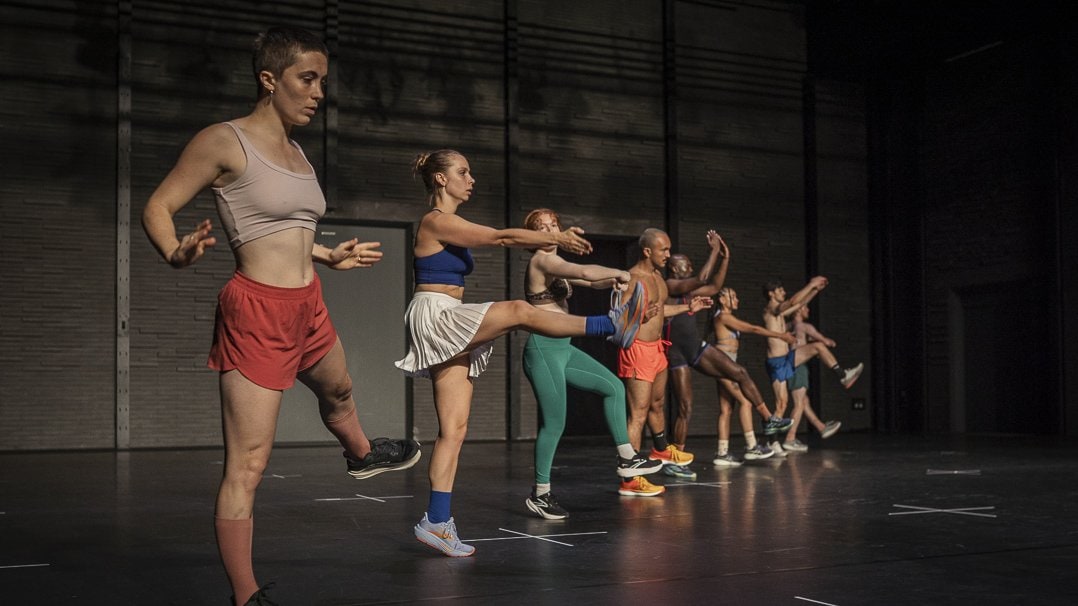 Dancers standing in a line diagonally