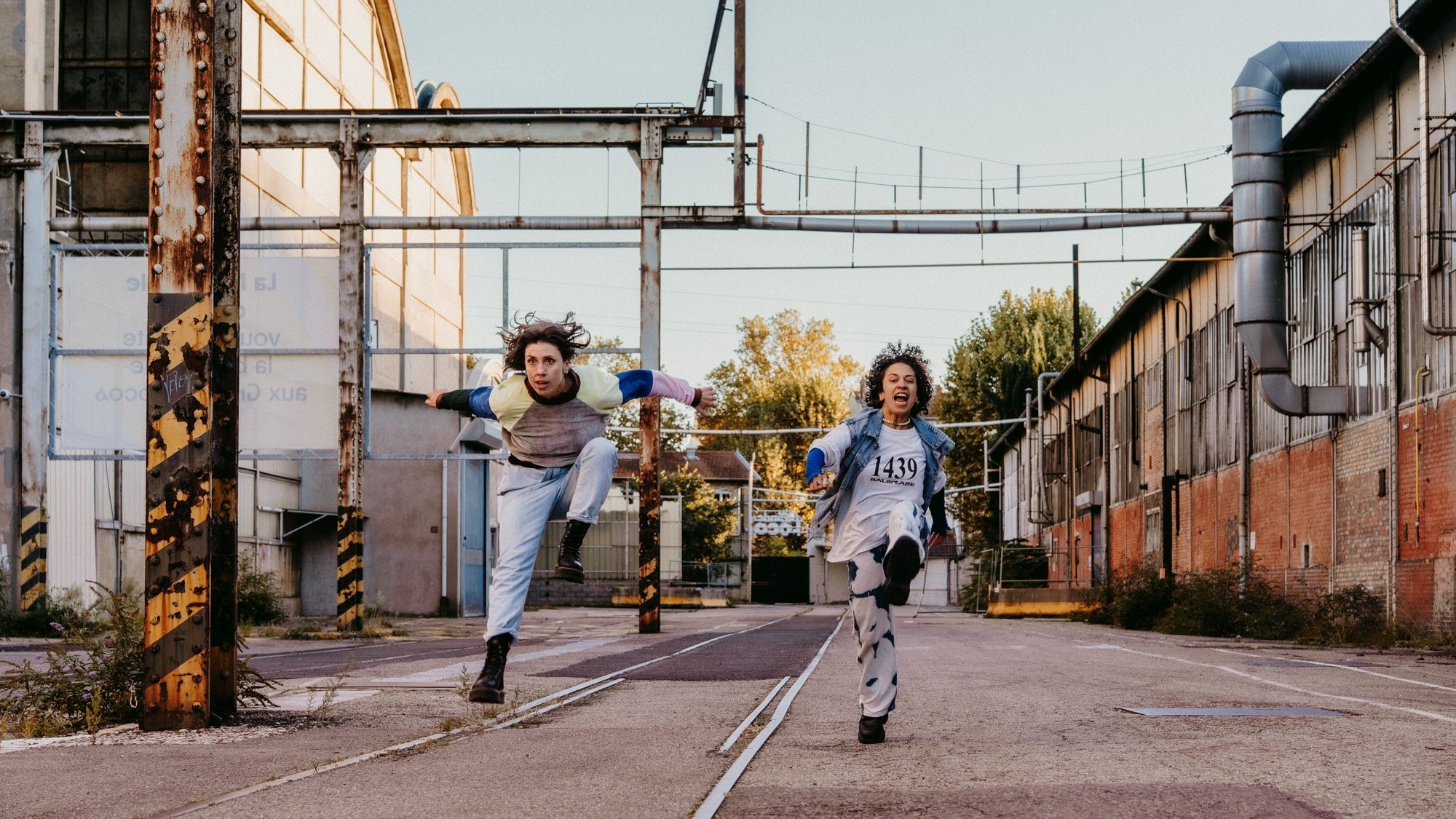 choreographers running and shouting in a street 