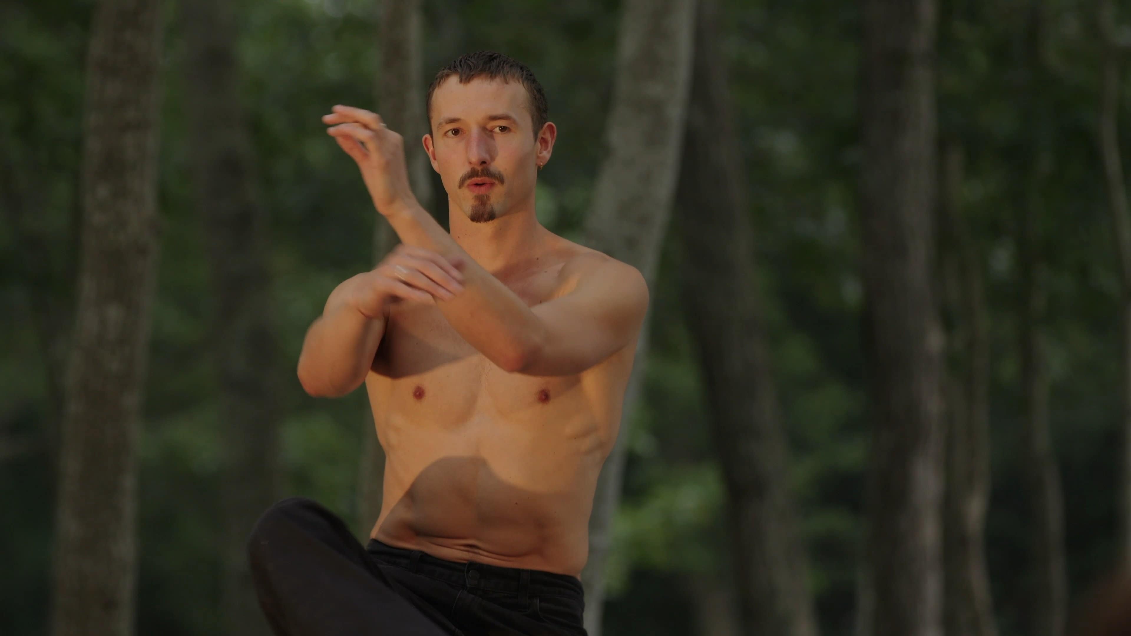 Cassiel Gaube dancing with his hands in front of him