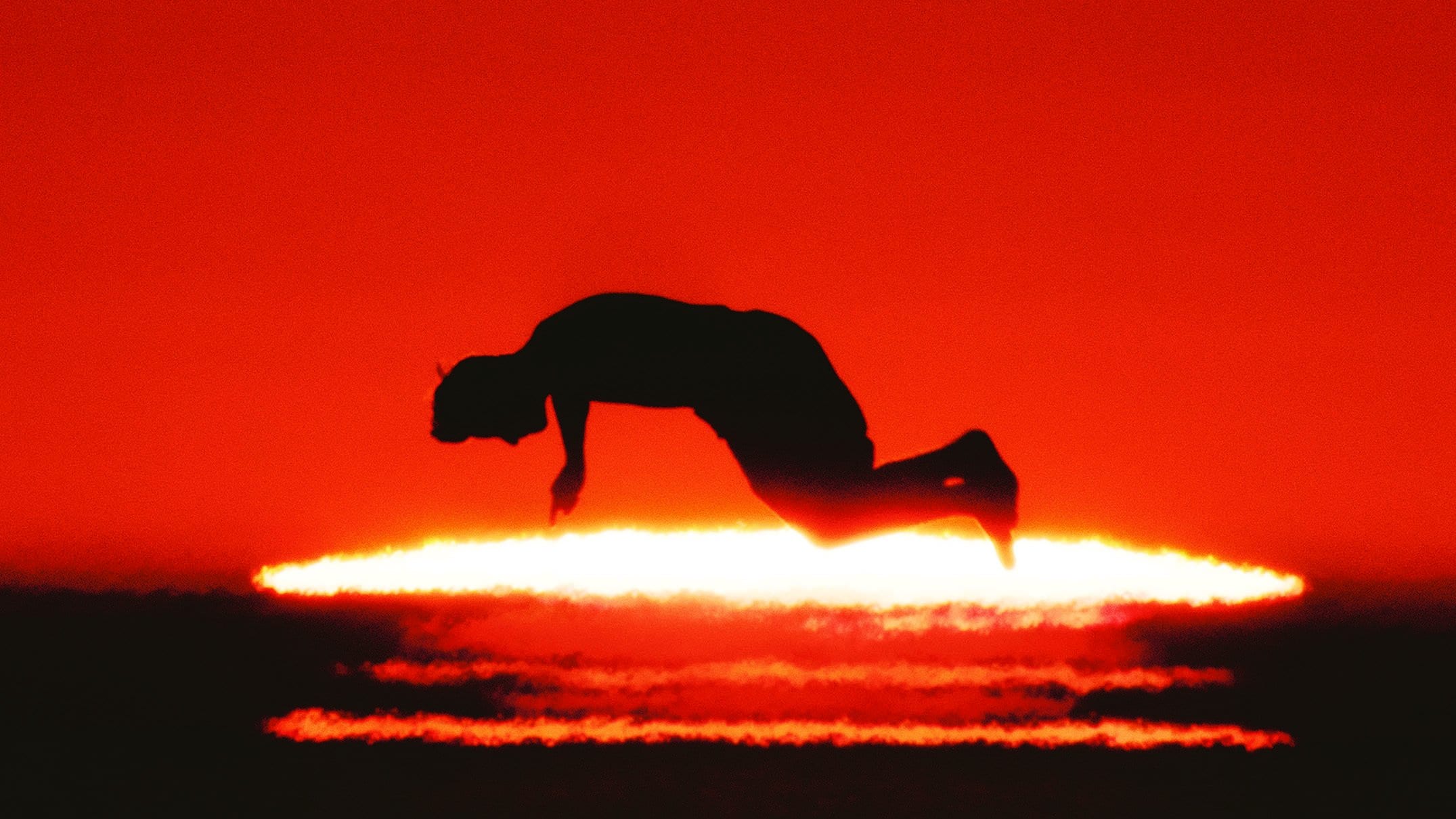 a silhouette in a red halo