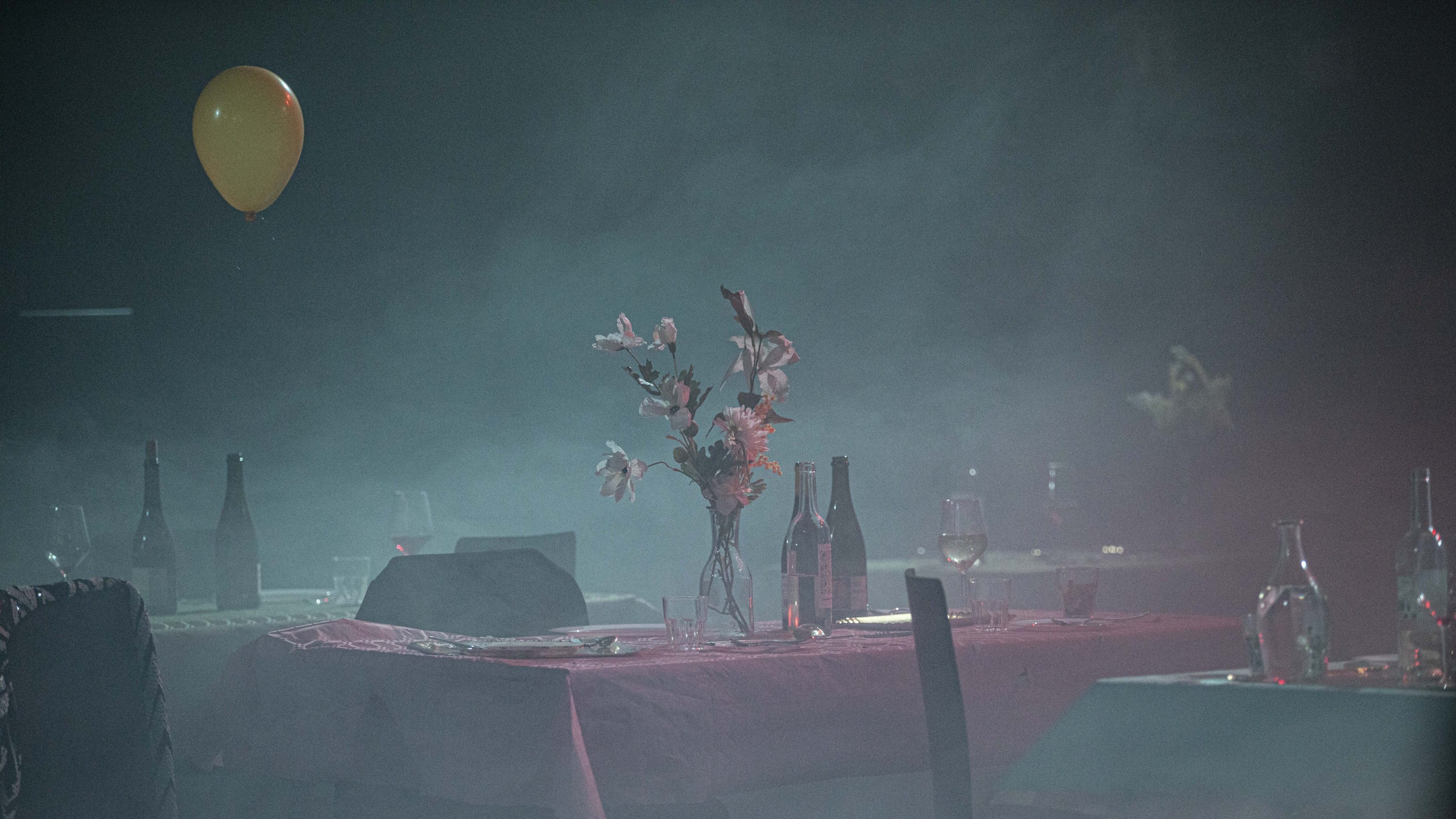 set dining table in a hazy atmosphere, with blue and red tones