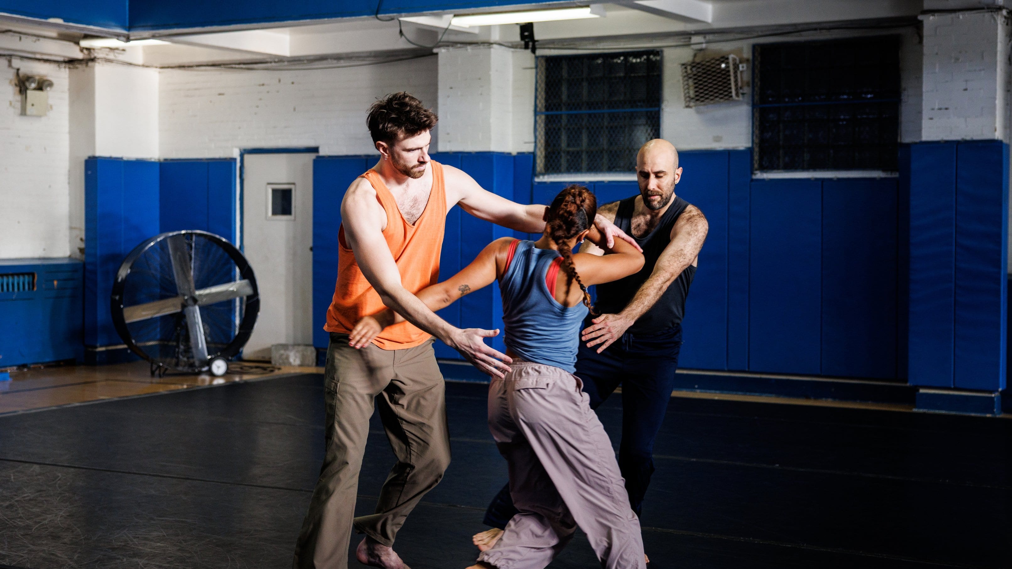 3 dancers in rehearsal