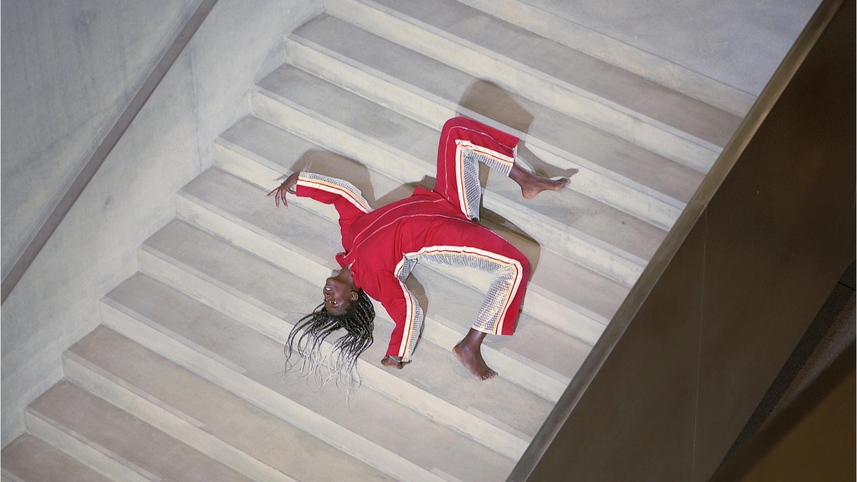 Performer upside down in a staircase