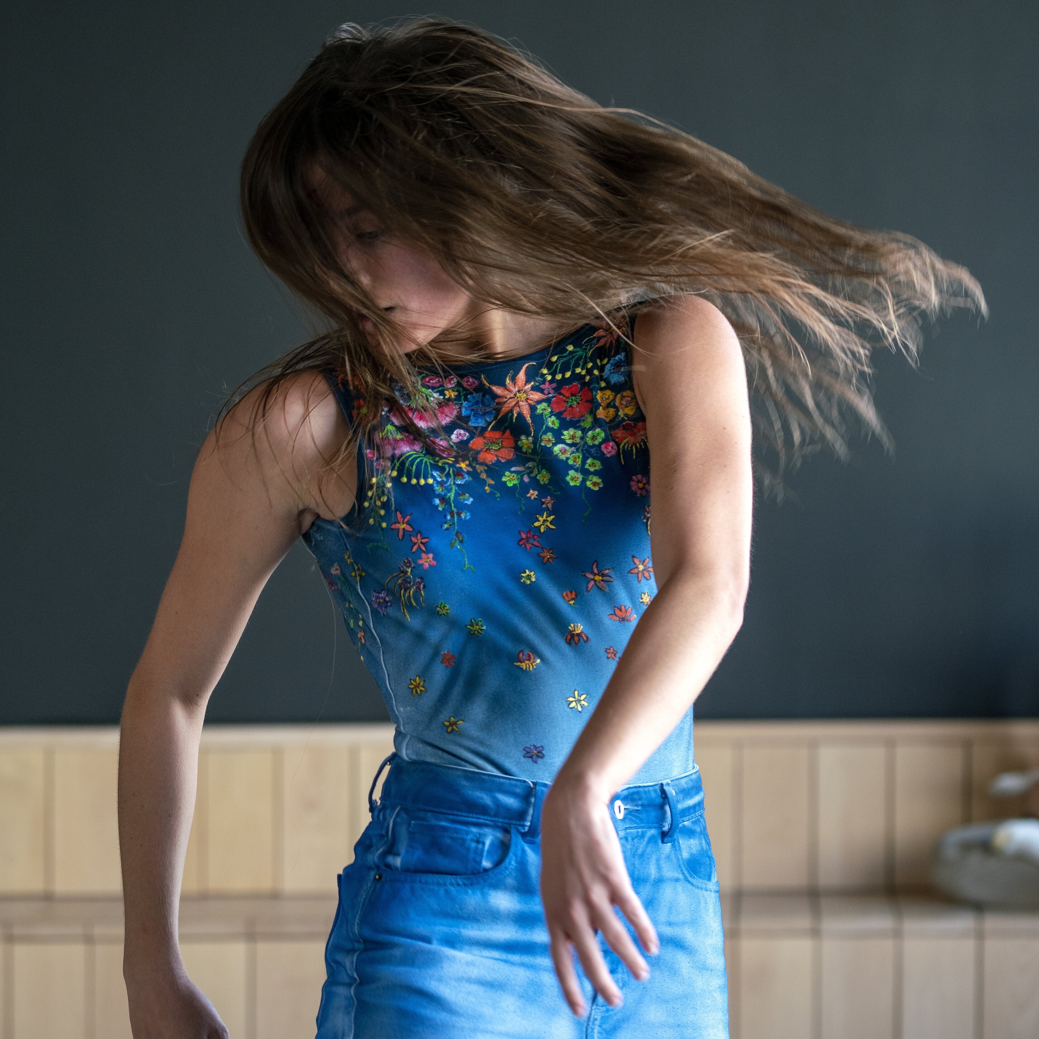 Dancer wearing blue moving