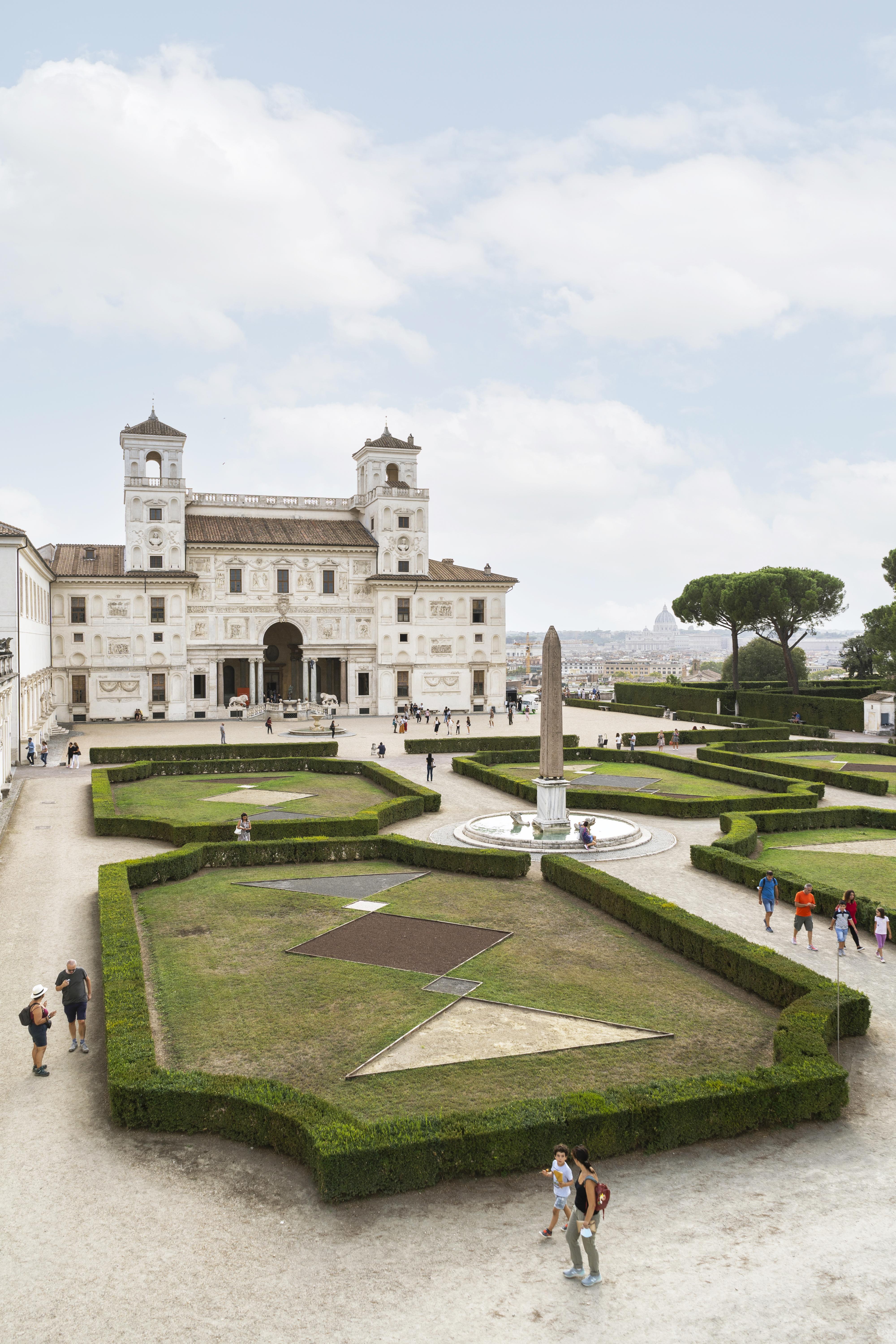 Outside view of the building of Villa Médicis and its gardens during daytime 